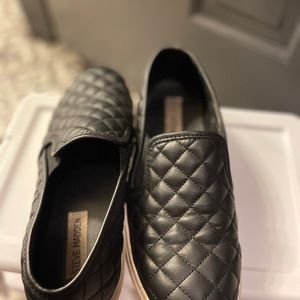 Steve Madden black leather slip ons